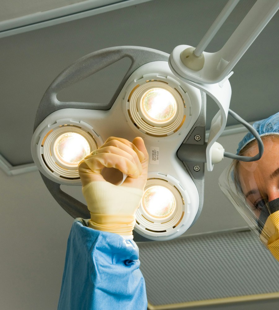 Surgeon adjusting an LED operating light